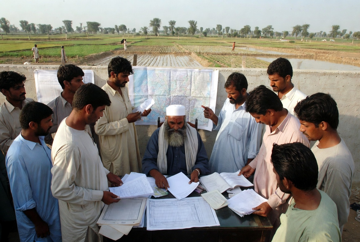 Infographic depicting how land ownership, mutations, and boundary marks are recorded in rural Pakistan
